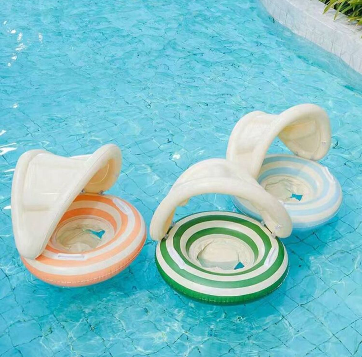 Bóia inflável com cobertura solar, alças e design anti-tombamento para segurança na piscina